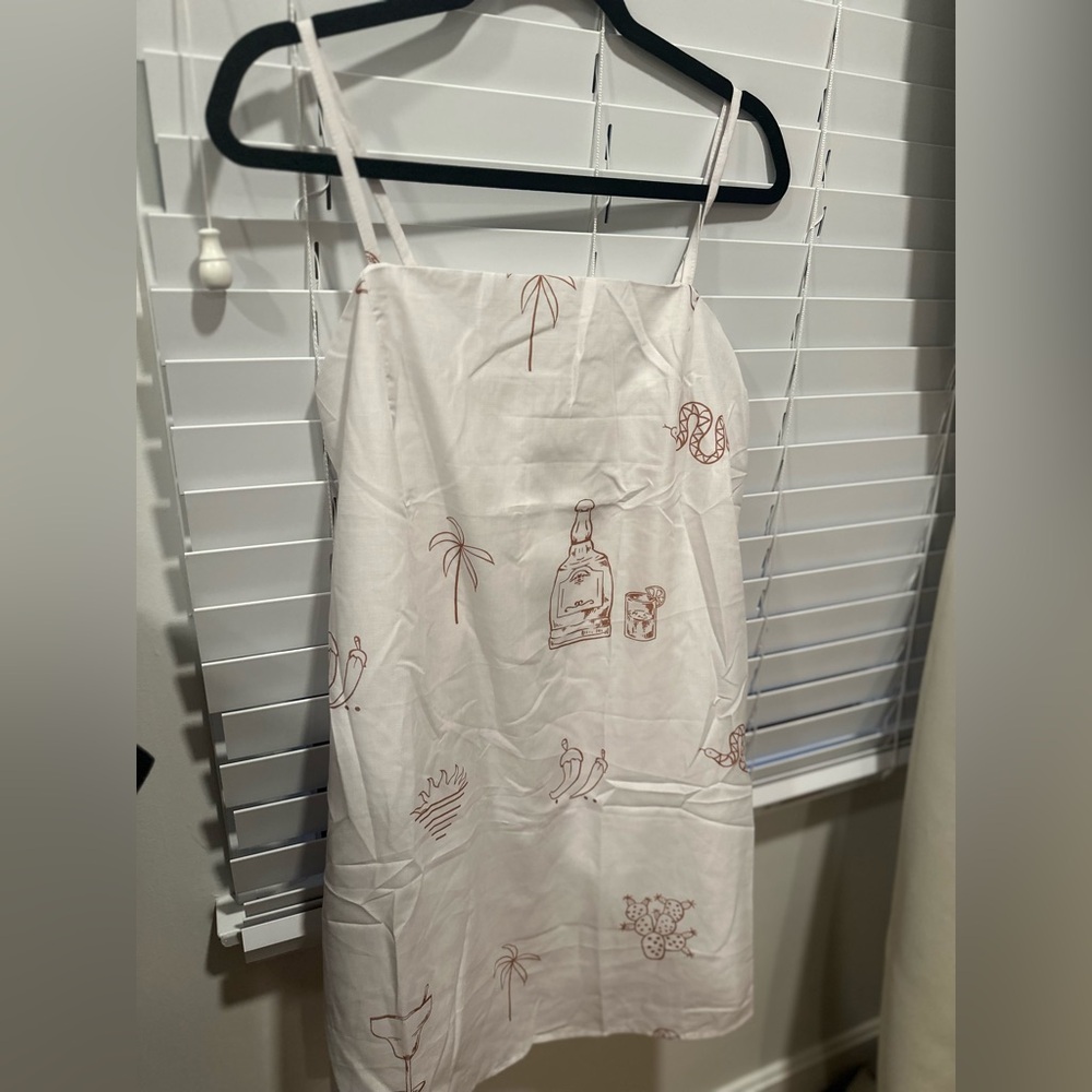 Chic White Dress with Brown Illustrations